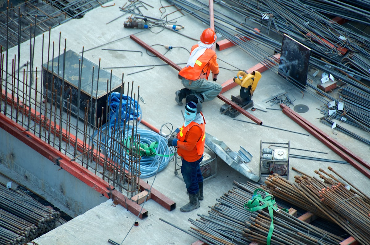 Jobsite photos pinned to a construction floor plan